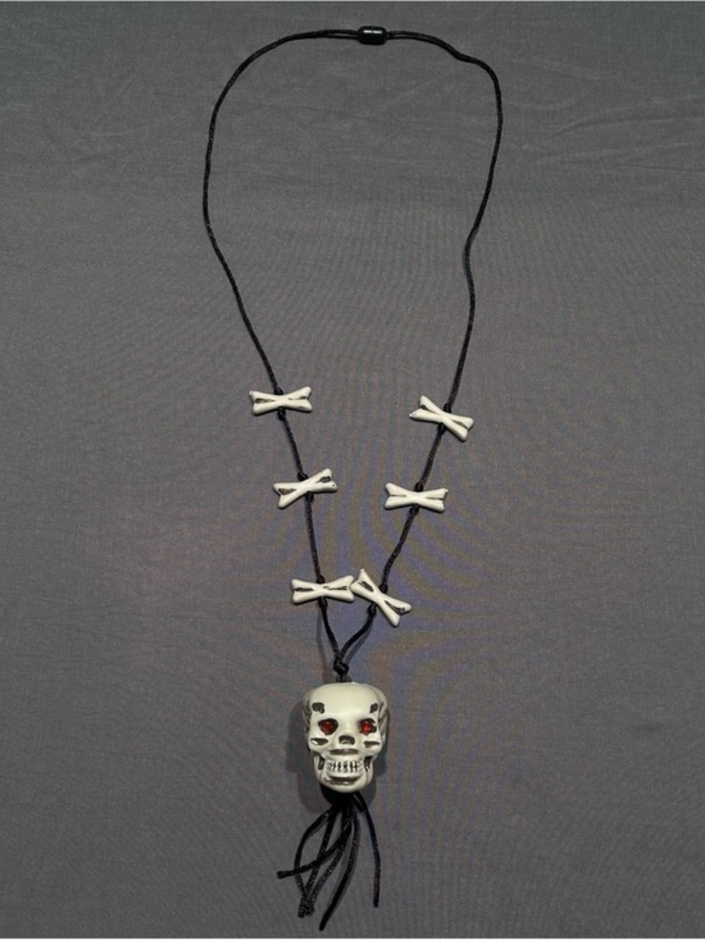 Greenbrier International Plastic Skull and Crossbones Cord Necklace